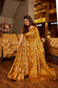 Soft Silk Bandhej printed saree attached by tassels on pallu - Mustard